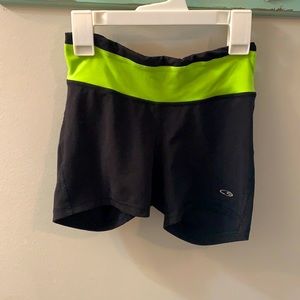 Black and lime green spanx by Champion, size XS.